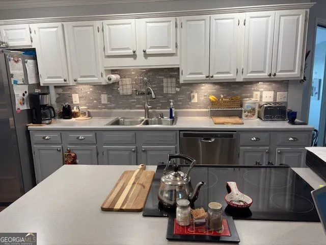 a kitchen with a sink and cabinets
