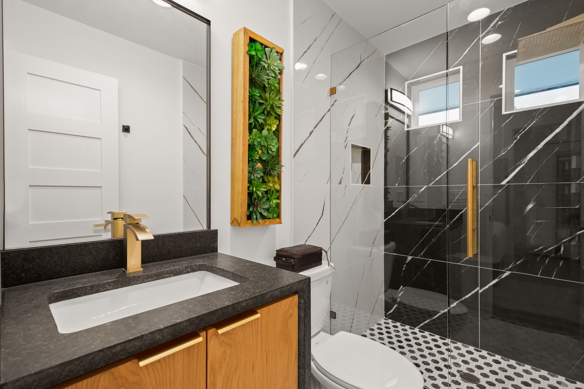 2416 East 10th Street Austin, TX 78702 - Photo 18 of 38 a bathroom with a sink a toilet and shower