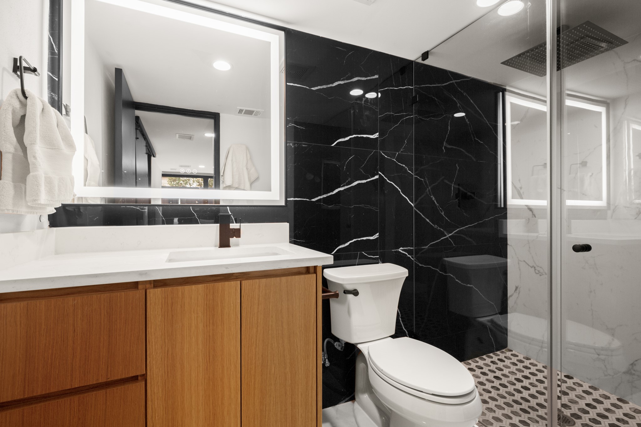 2416 East 10th Street Austin, TX 78702 - Photo 30 of 38 a bathroom with a toilet sink and shower