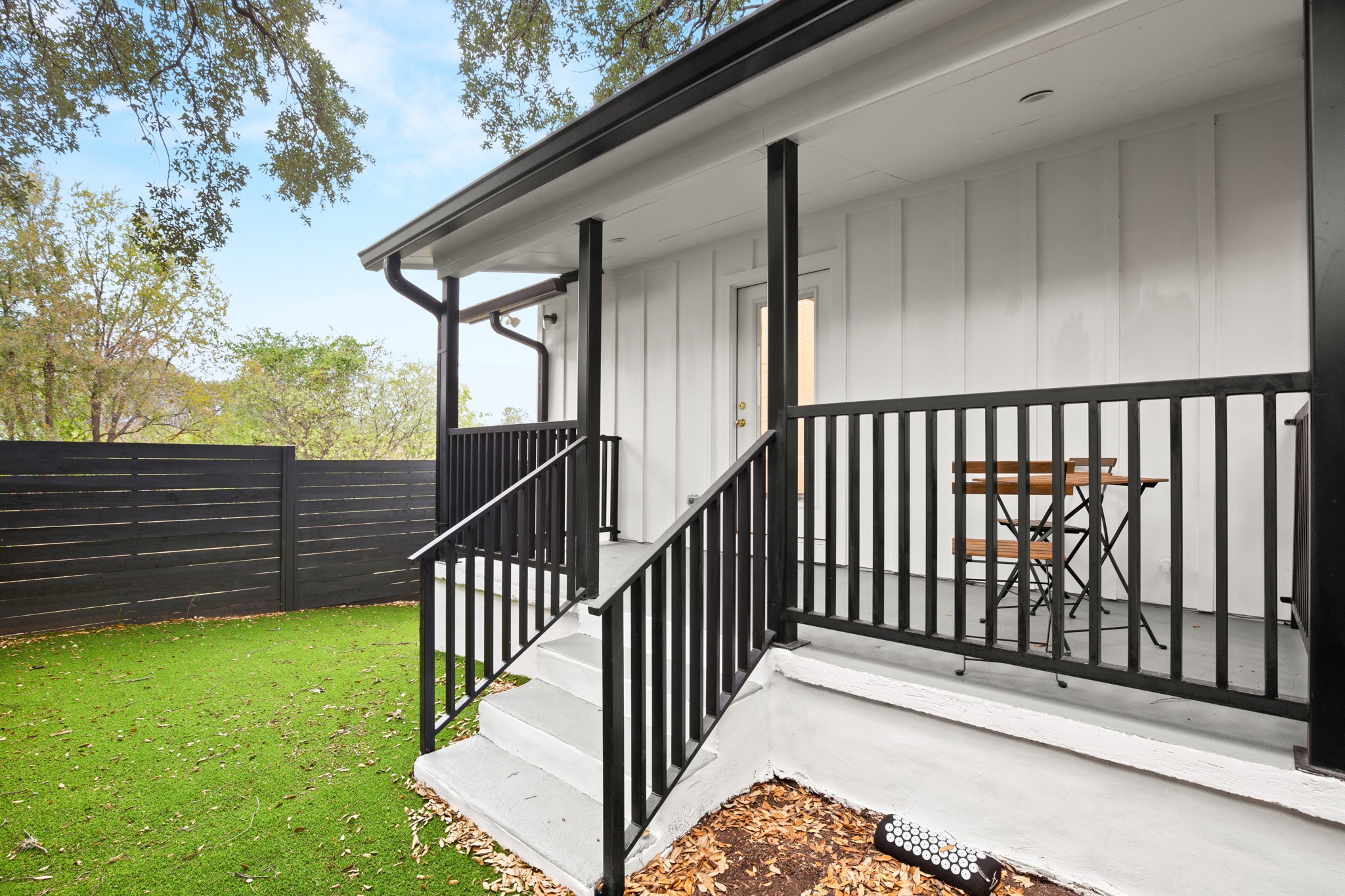 2416 East 10th Street Austin, TX 78702 - Photo 32 of 38 a view of a porch with wooden floor and fence
