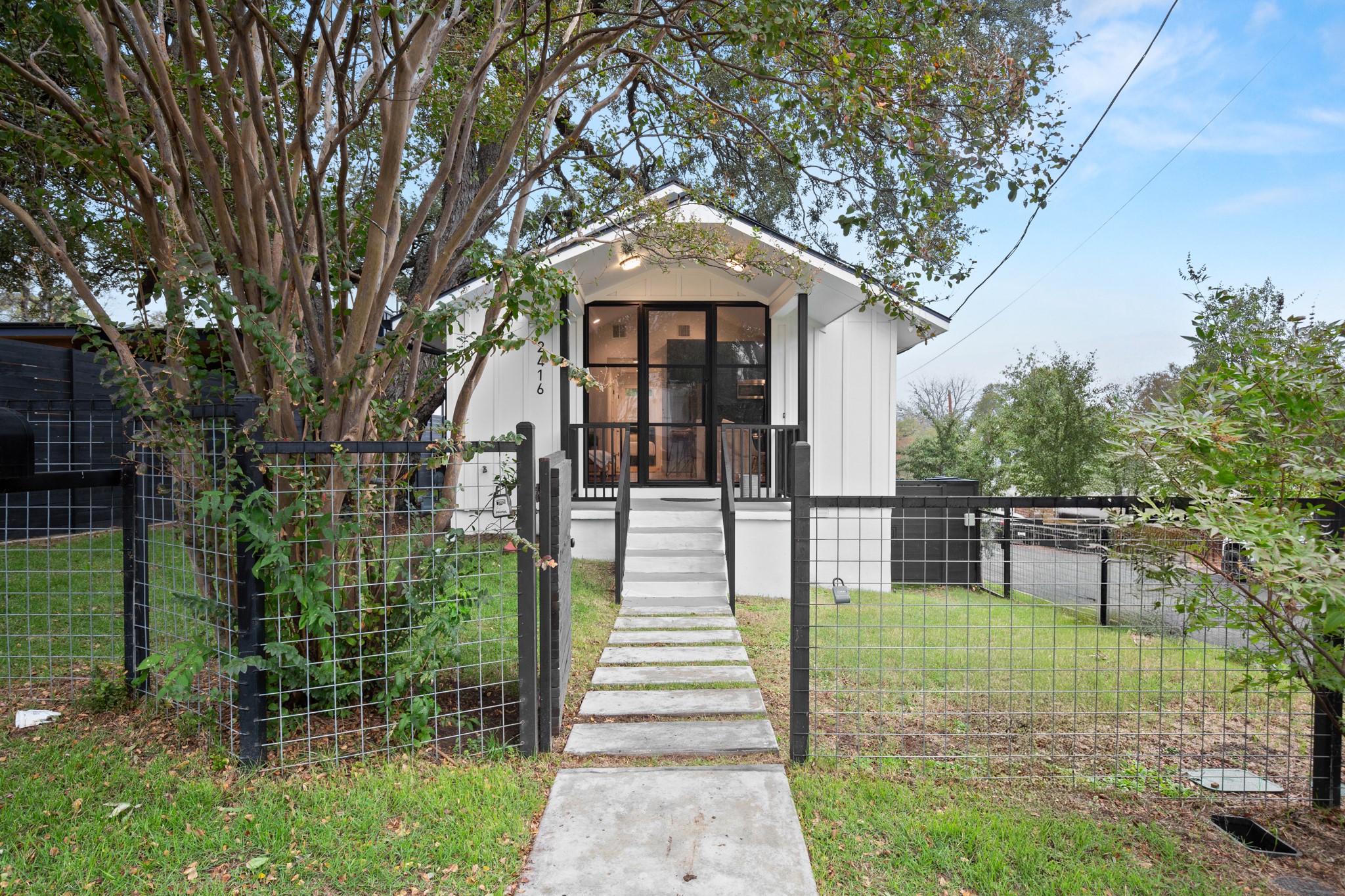 2416 East 10th Street Austin, TX 78702 - Photo 35 of 38 a front view of a house with a garden