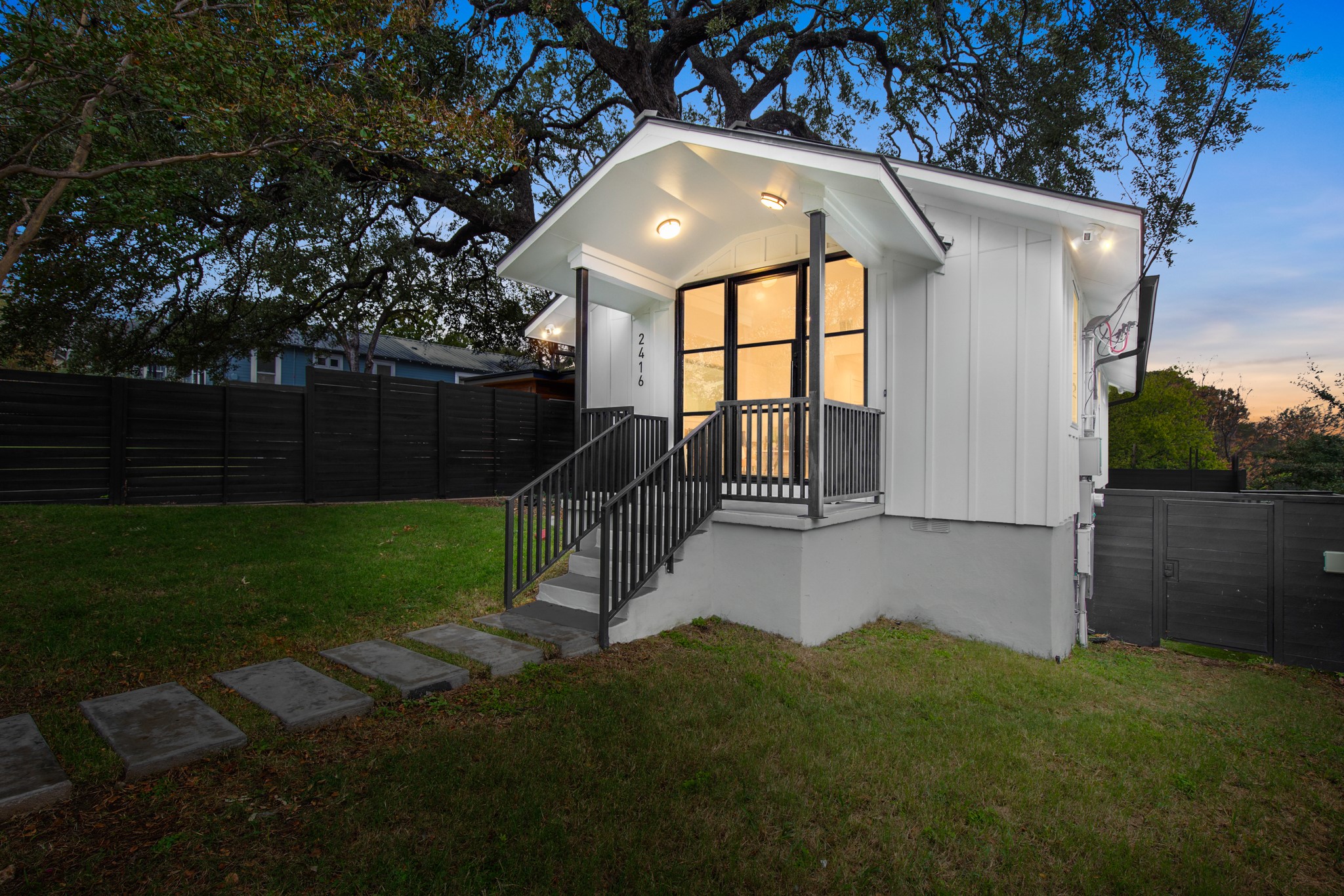 2416 East 10th Street Austin, TX 78702 - Photo 36 of 38 a front view of a house with garden