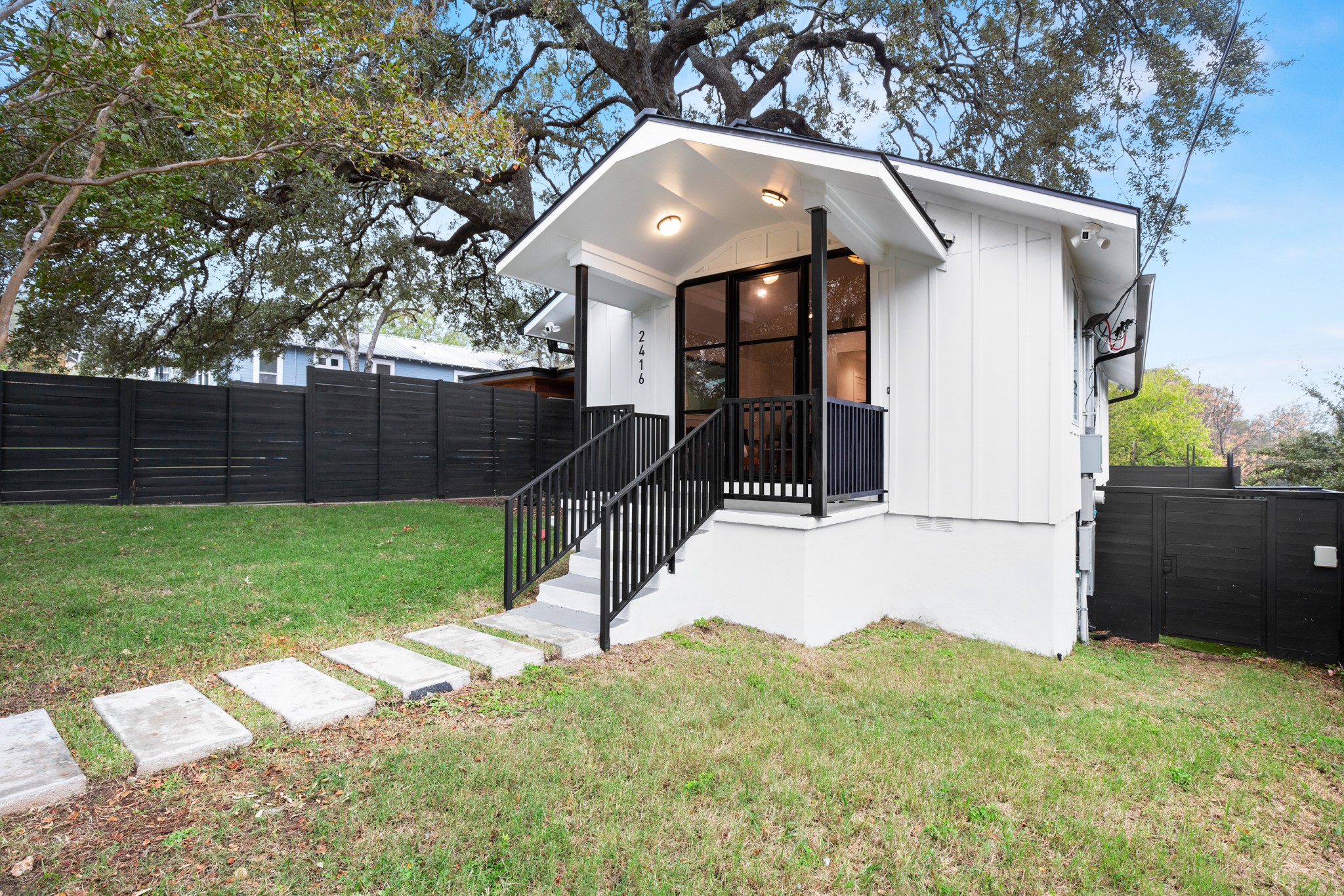 2416 East 10th Street Austin, TX 78702 - Photo 37 of 38 a front view of a house with a yard