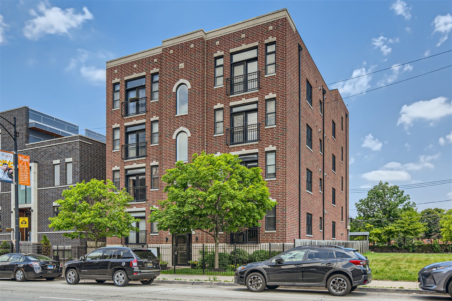 3719 South Indiana Avenue, Unit 4S Chicago, IL 60653 - Photo 1 of 17 a front view of a building with trees