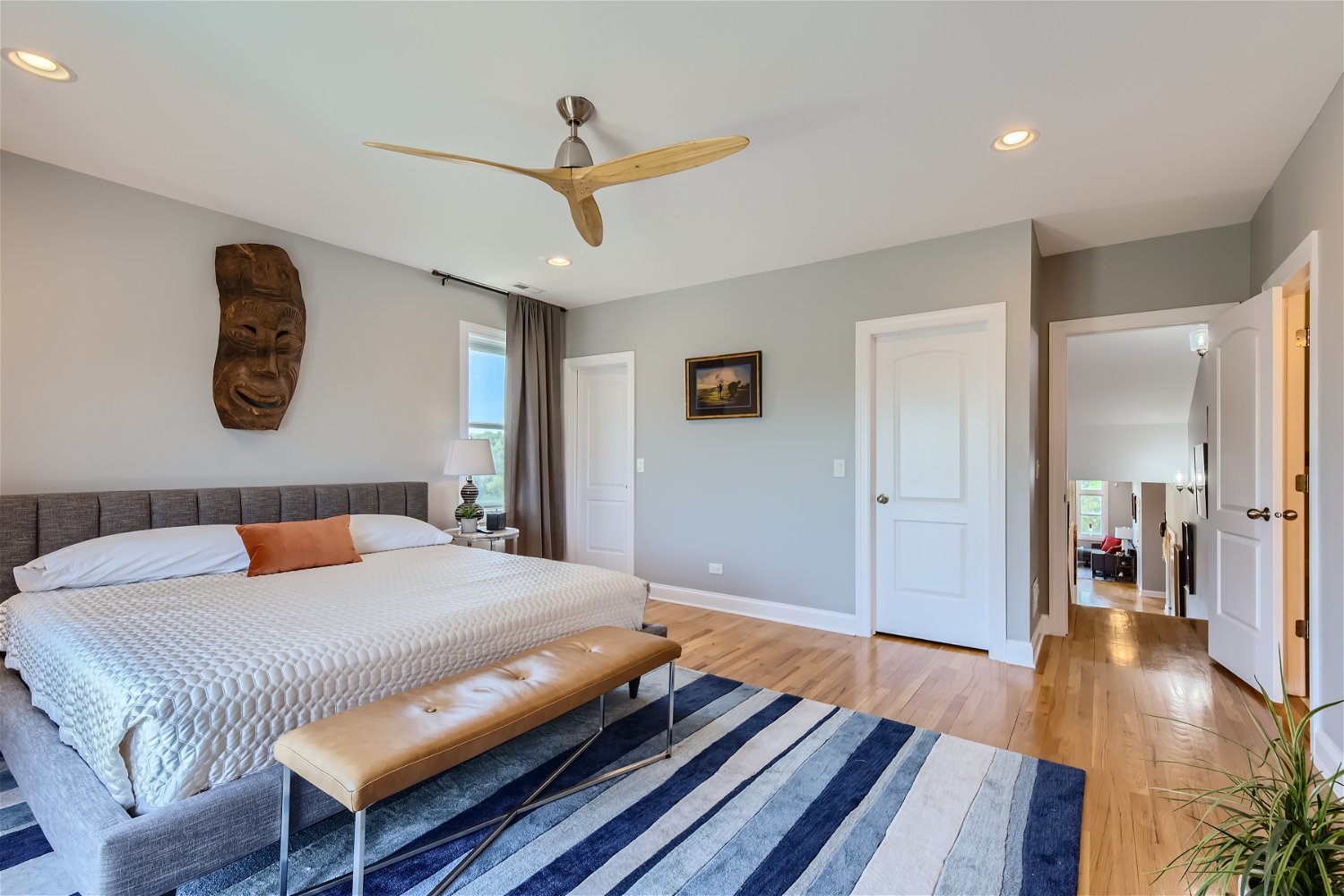 3719 South Indiana Avenue, Unit 4S Chicago, IL 60653 - Photo 11 of 17 a bedroom with a bed and wooden floor