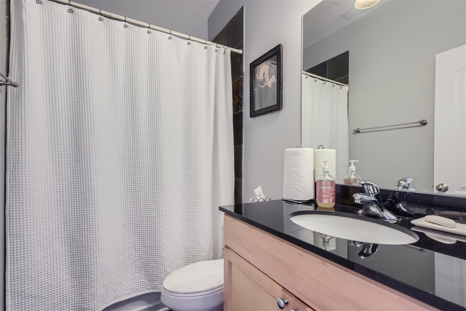 3719 South Indiana Avenue, Unit 4S Chicago, IL 60653 - Photo 15 of 17 a bathroom with a granite countertop sink and a mirror