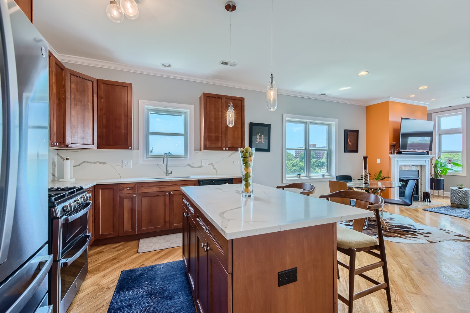 3719 South Indiana Avenue, Unit 4S Chicago, IL 60653 - Photo 9 of 17 a kitchen with stainless steel appliances granite countertop a sink stove and cabinets