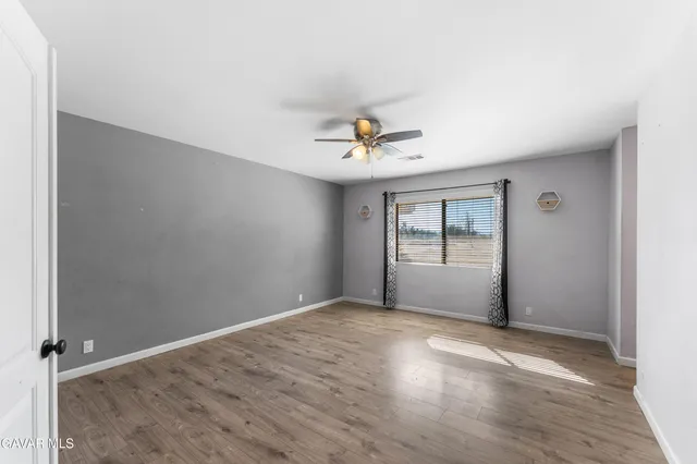 an empty room with a empty space and windows