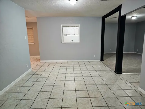 a view of an empty room and window