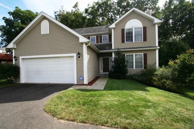 62 Meadow Brook Road Brookfield, CT 06804 - Photo 1 of 1 a front view of a house with a yard and garage