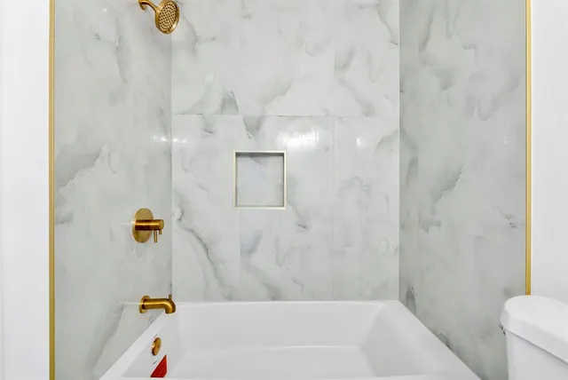 a bathroom with a bath tub