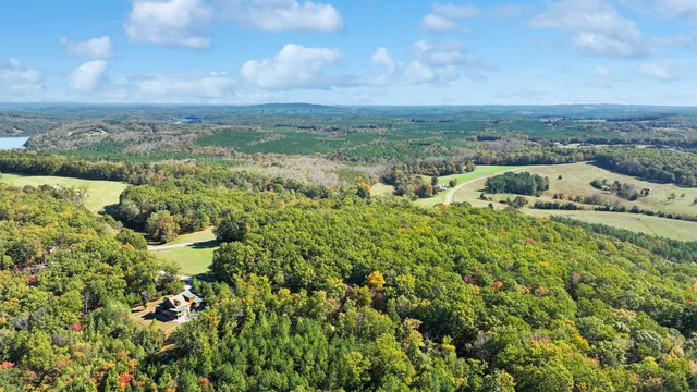 an aerial view of houses with yard