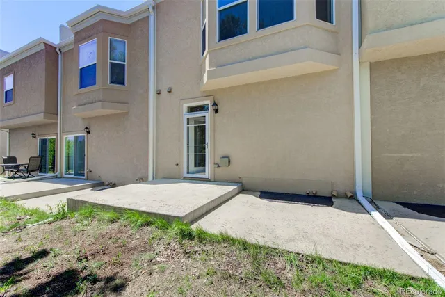 a view of backyard of a house