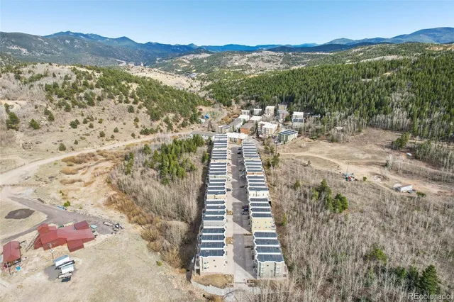 a view of a city with mountains in the background