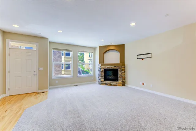a view of empty room with a fireplace
