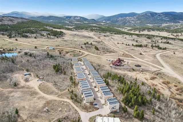 a view of ocean and a mountain