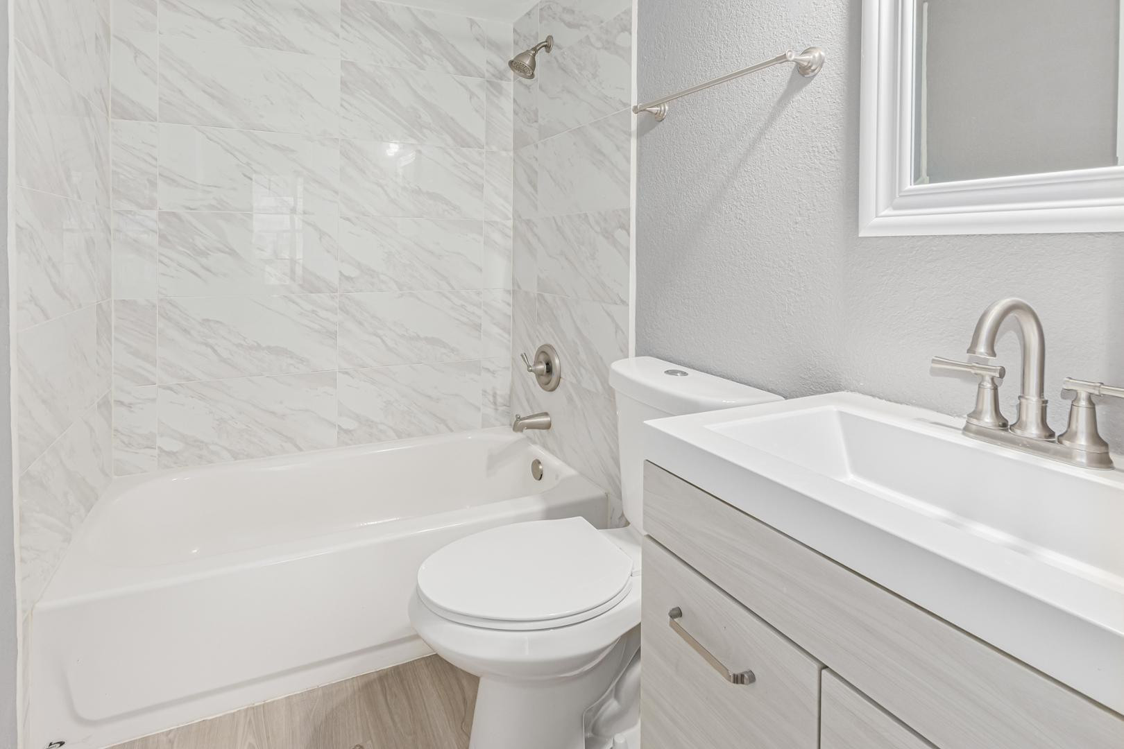 1077 West 1st Street, Unit 203 Tempe, AZ 85281 - Photo 20 of 22 a bathroom with a sink a toilet and a bathtub