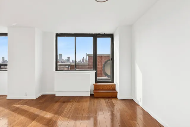 a workspace with furniture and a potted plant