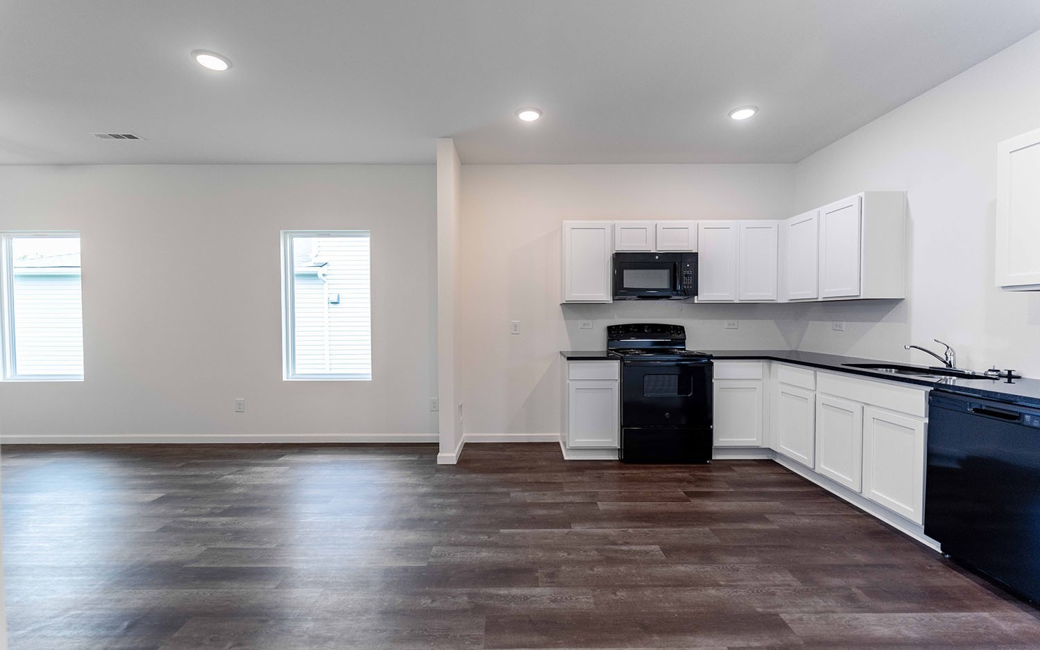 97 Stonehenge Lane Manchester, TN 37355 - Photo 3 of 8 a kitchen with granite countertop a stove top oven a sink and a granite counter top