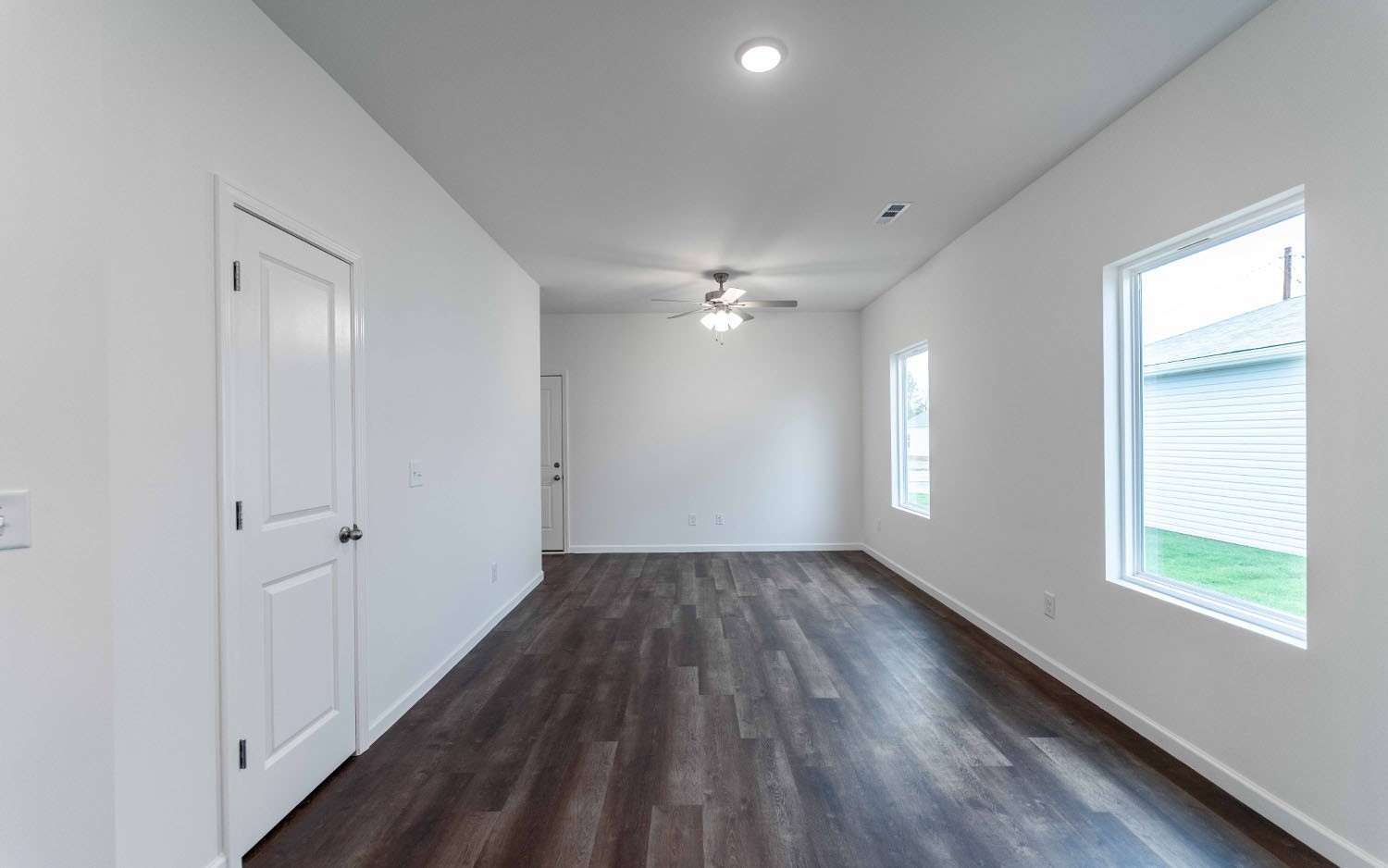 97 Stonehenge Lane Manchester, TN 37355 - Photo 4 of 8 a view of an empty room with wooden floor and a window