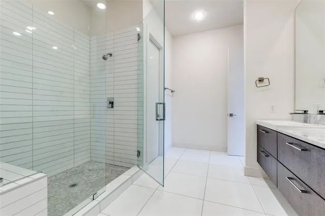 a bathroom with a shower and a sink