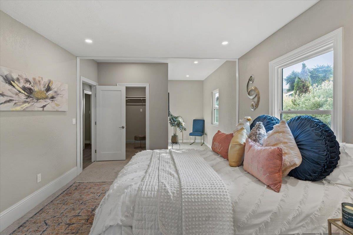 1306 Channing Way Berkeley, CA 94702 - Photo 14 of 42 a bedroom with a large bed and a painting on the wall