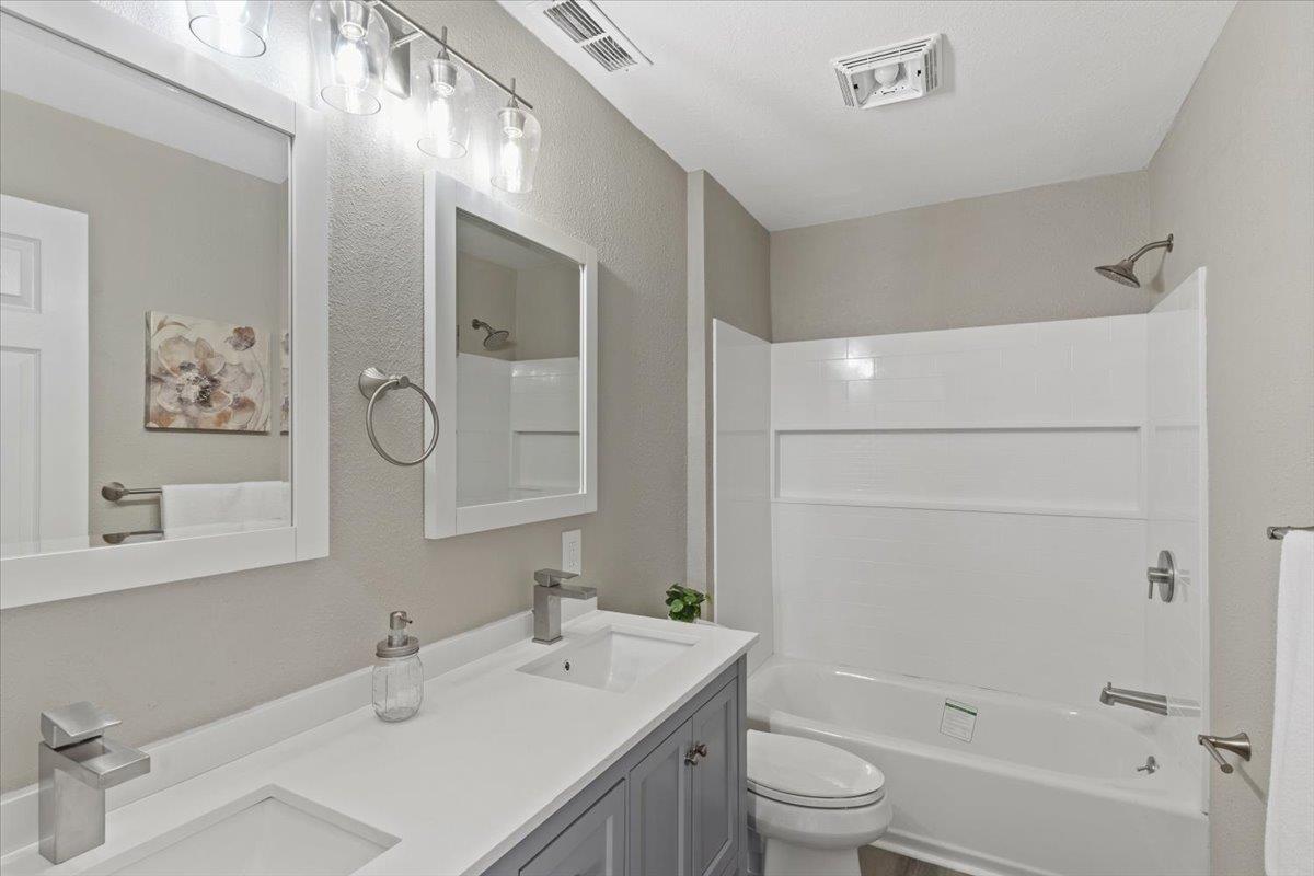 1306 Channing Way Berkeley, CA 94702 - Photo 16 of 42 a bathroom with a sink a toilet and shower