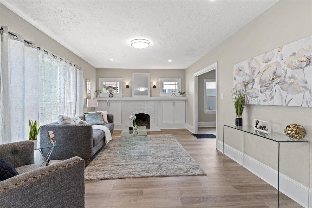 1306 Channing Way Berkeley, CA 94702 - Photo 2 of 42 a living room with furniture and a fireplace