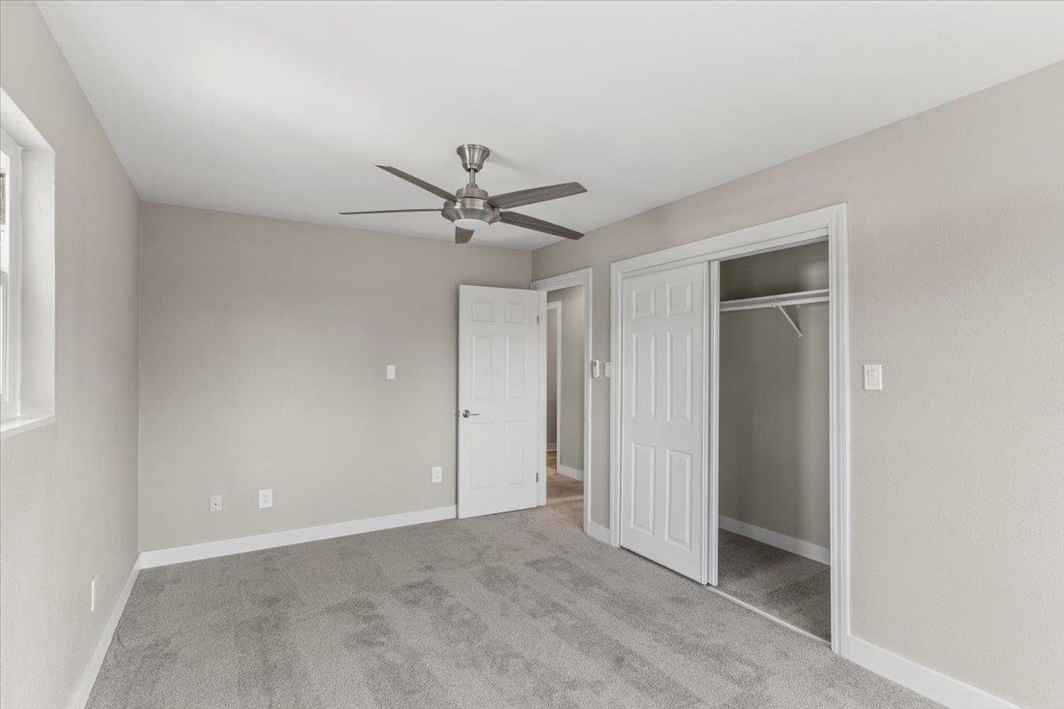 1306 Channing Way Berkeley, CA 94702 - Photo 25 of 42 an empty room with a ceiling fan and a window