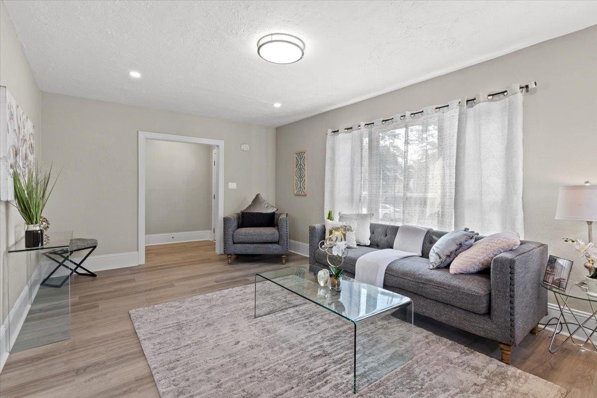 1306 Channing Way Berkeley, CA 94702 - Photo 3 of 42 a living room with furniture and a large window