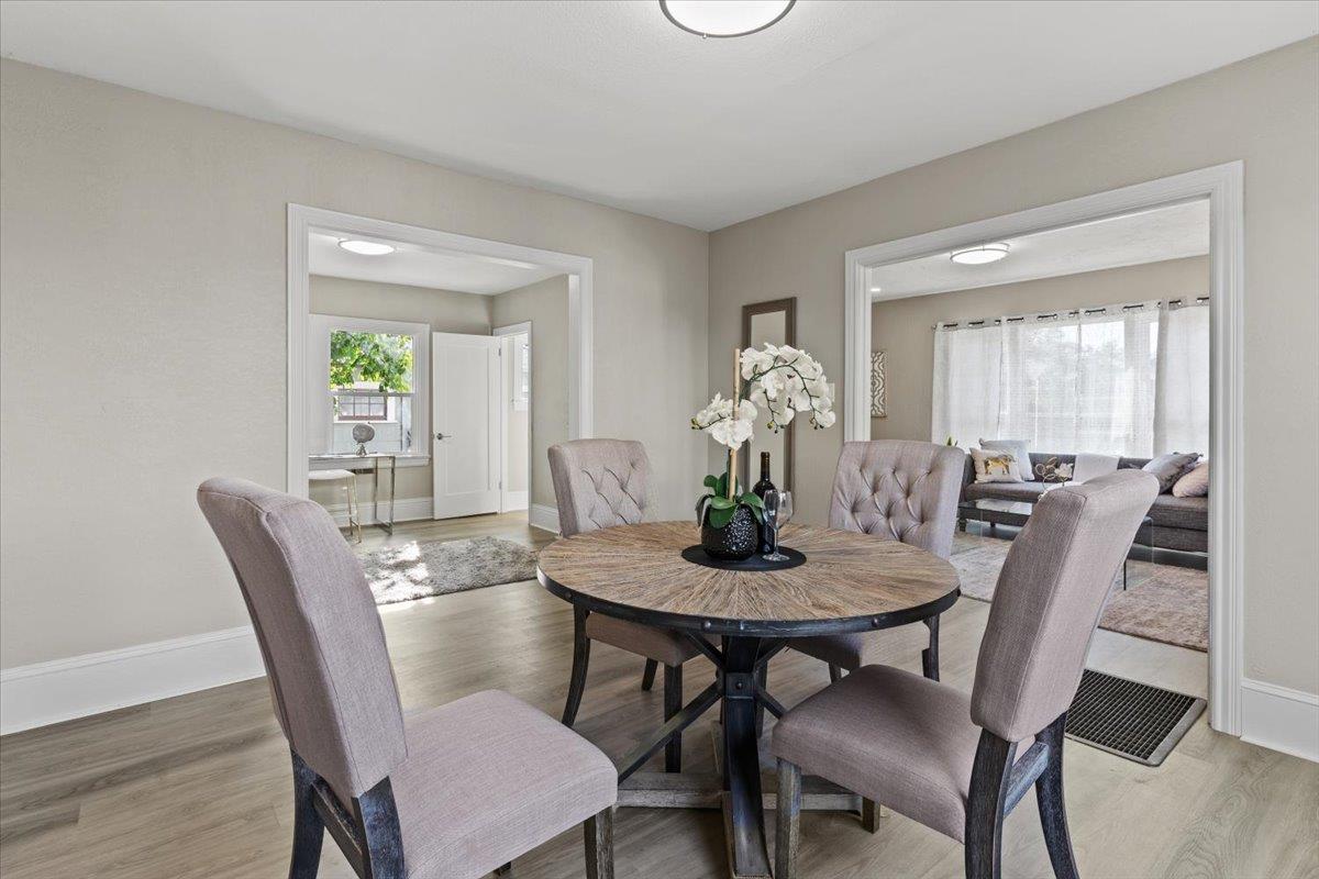 1306 Channing Way Berkeley, CA 94702 - Photo 6 of 42 a view of a dining room with furniture and wooden floor