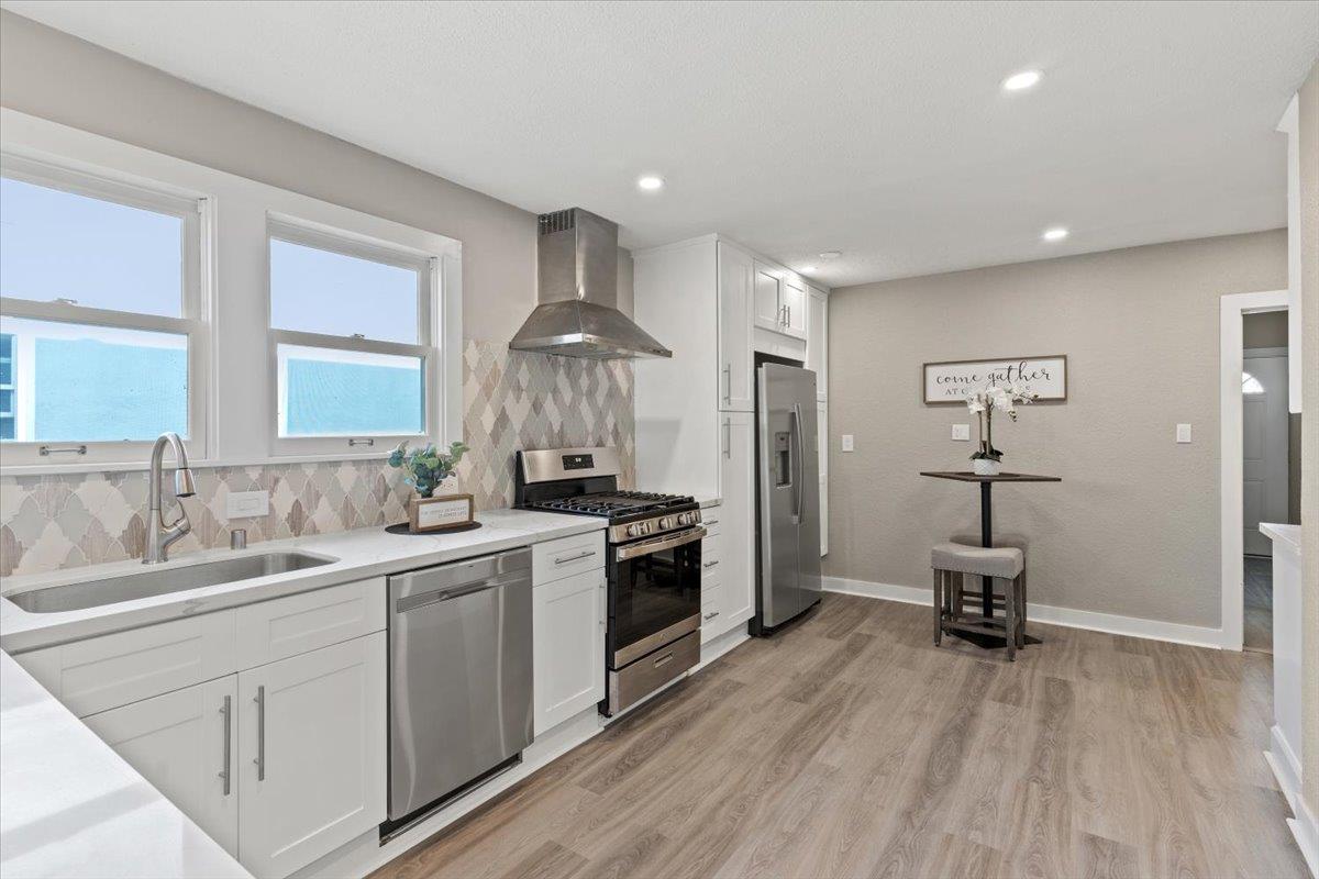 1306 Channing Way Berkeley, CA 94702 - Photo 9 of 42 a kitchen with a sink cabinets and wooden floor