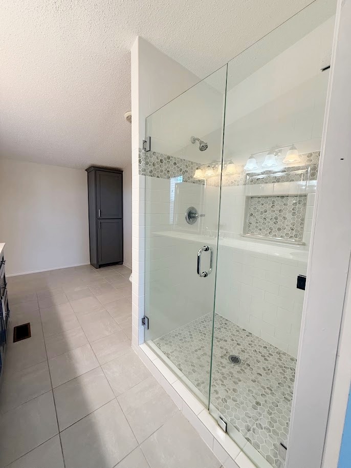 2709 County Road 463 Elgin, TX 78621 - Photo 12 of 25 a bathroom with a shower and a sink