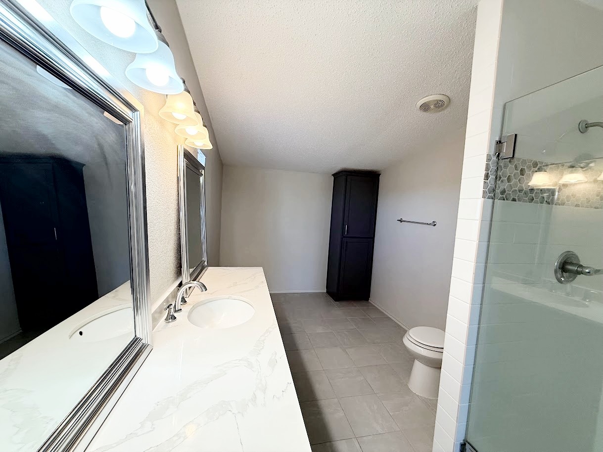 2709 County Road 463 Elgin, TX 78621 - Photo 14 of 25 a bathroom with a sink a toilet and shower