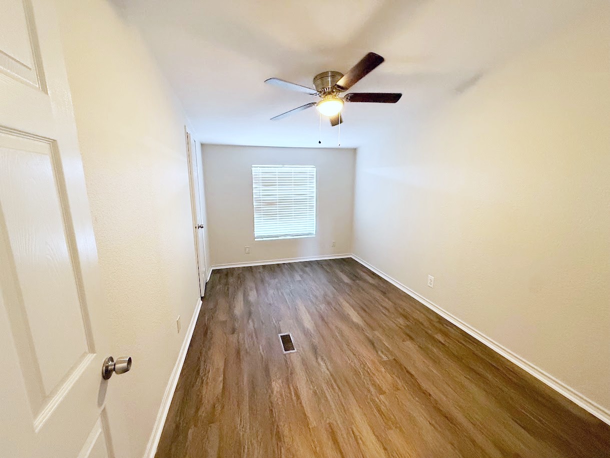 2709 County Road 463 Elgin, TX 78621 - Photo 22 of 25 a view of wooden floor in a room