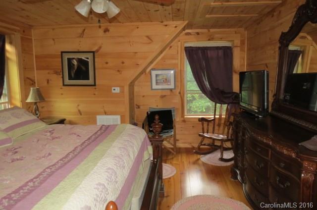 7275 Poors Ford Road Rutherfordton, NC 28139 - Photo 15 of 24 a bedroom with a bed a flat screen tv and dresser