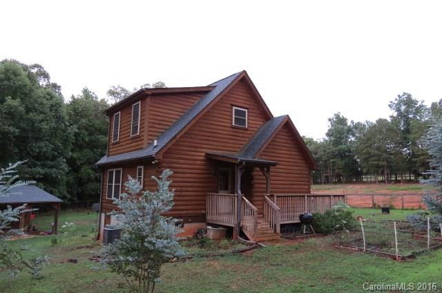 7275 Poors Ford Road Rutherfordton, NC 28139 - Photo 18 of 24 a front view of a house with a garden