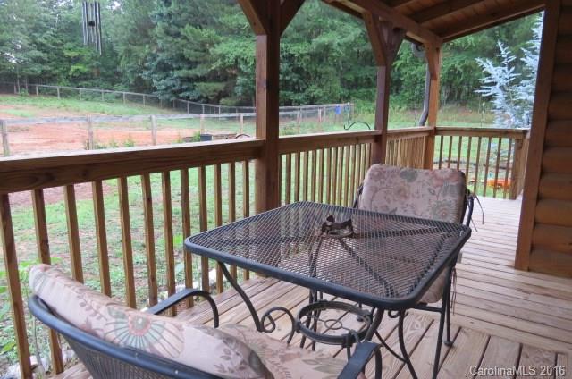 7275 Poors Ford Road Rutherfordton, NC 28139 - Photo 20 of 24 a view of a chairs and table in the deck