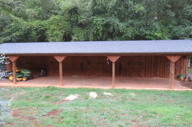 7275 Poors Ford Road Rutherfordton, NC 28139 - Photo 3 of 24 an outdoor sitting area with chairs
