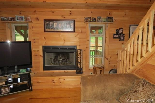 7275 Poors Ford Road Rutherfordton, NC 28139 - Photo 8 of 24 a view of a livingroom with furniture and a fireplace