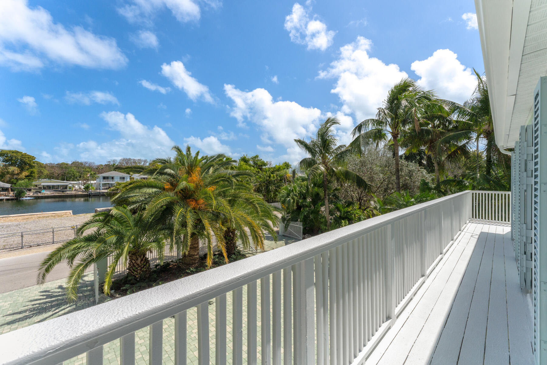 79 Jean La Fitte Drive Key Largo, FL 33037 - Photo 21 of 62 a view of balcony with wooden floor and lake view