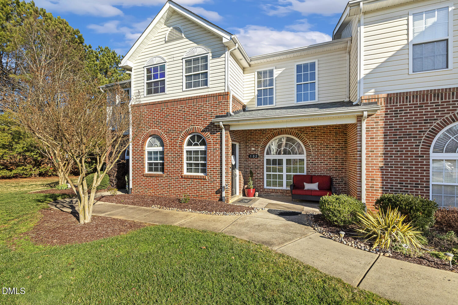 2131 Piney Brook Road, Unit 102 Raleigh, NC 27614 - Photo 1 of 23 a front view of a house with garden