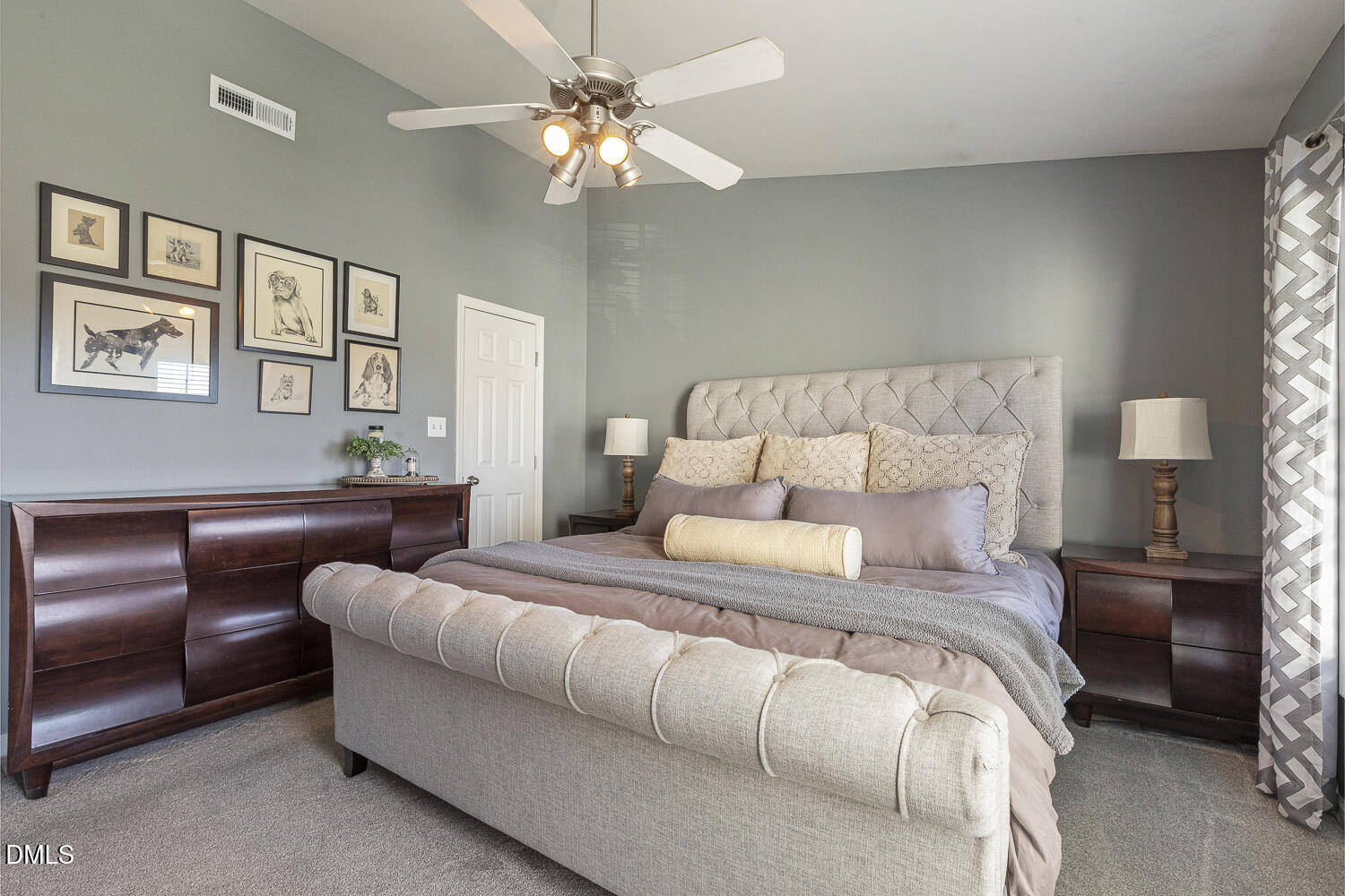 2131 Piney Brook Road, Unit 102 Raleigh, NC 27614 - Photo 14 of 23 a bedroom with a large bed couch and a chandelier