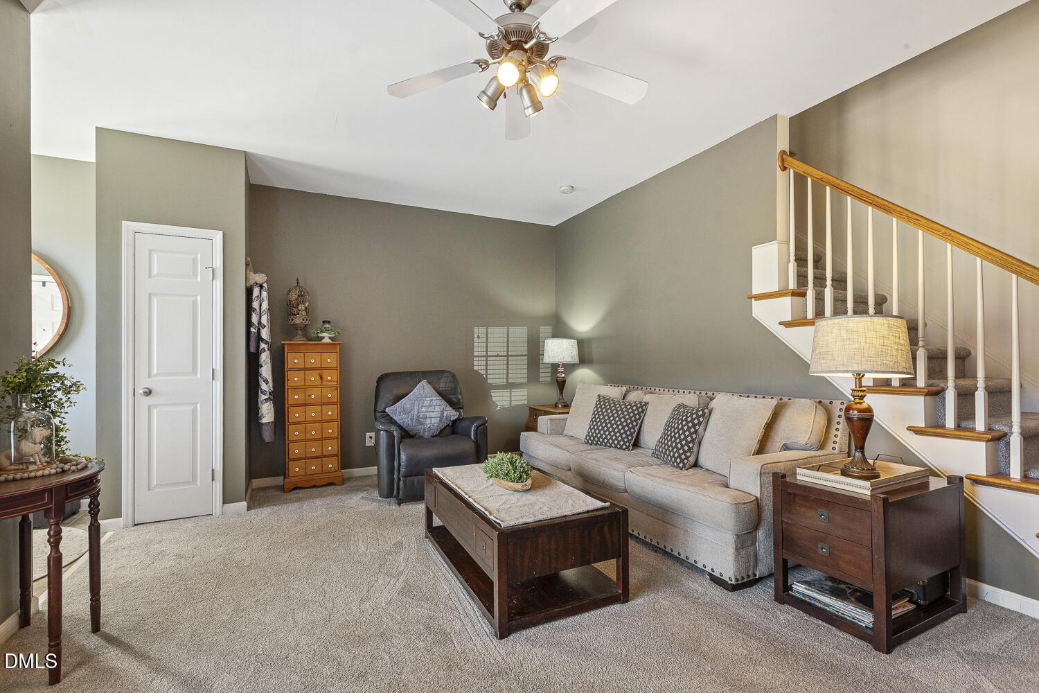 2131 Piney Brook Road, Unit 102 Raleigh, NC 27614 - Photo 7 of 23 a living room with furniture and a chandelier