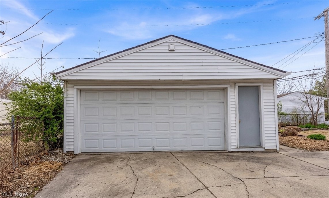 3318 Milverton Road, Unit 1/DN Shaker Heights, OH 44120 - Photo 21 of 21 Detached garage with a paneled overhead door and a side entry door