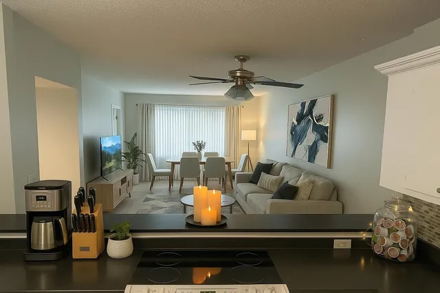a living room with furniture and flowers
