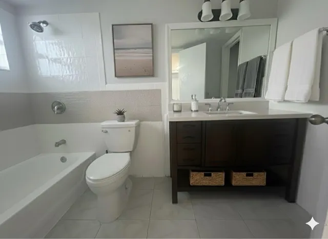 a bathroom with a sink a toilet and a bathtub