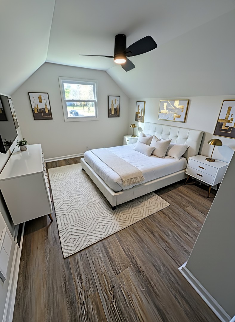 267 Arrowhead Street Park Forest, IL 60466 - Photo 11 of 12 a bedroom with a bed and wooden floor