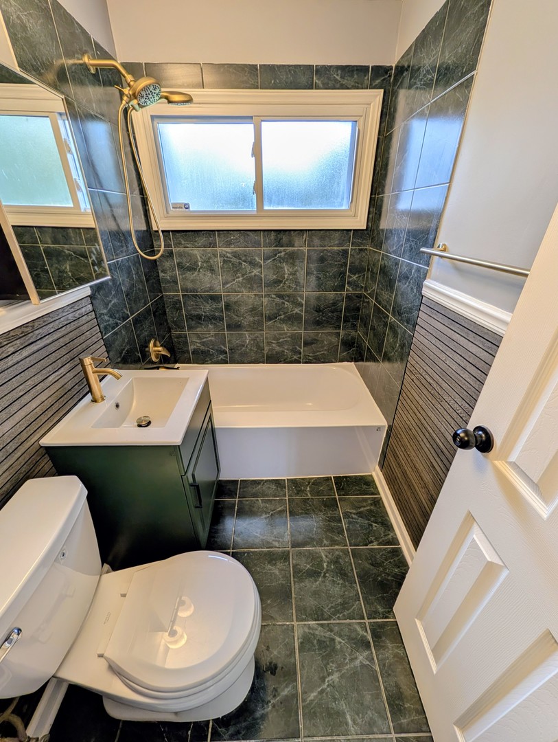 267 Arrowhead Street Park Forest, IL 60466 - Photo 10 of 12 a bathroom with a sink and mirror