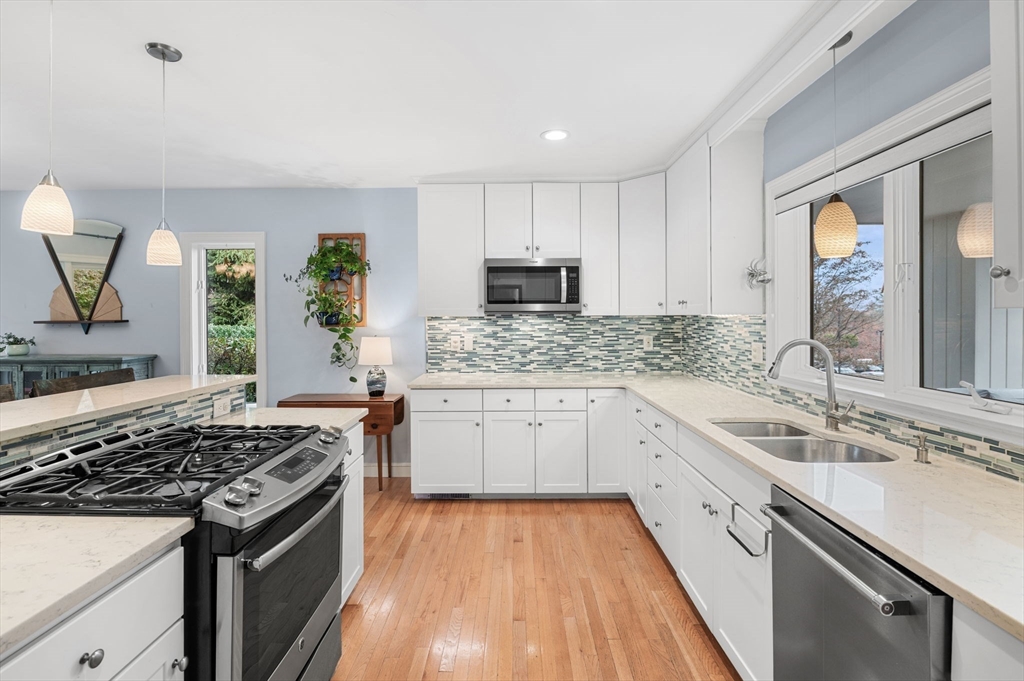 1 Court Lane Ipswich, MA 01938 - Photo 16 of 40 a kitchen with a sink stove top oven and microwave